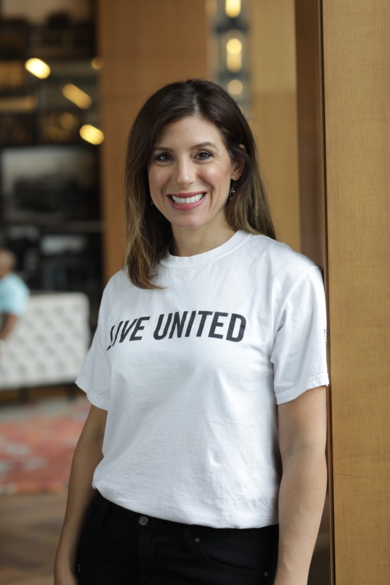 Theresa smiling in a United Way shirt